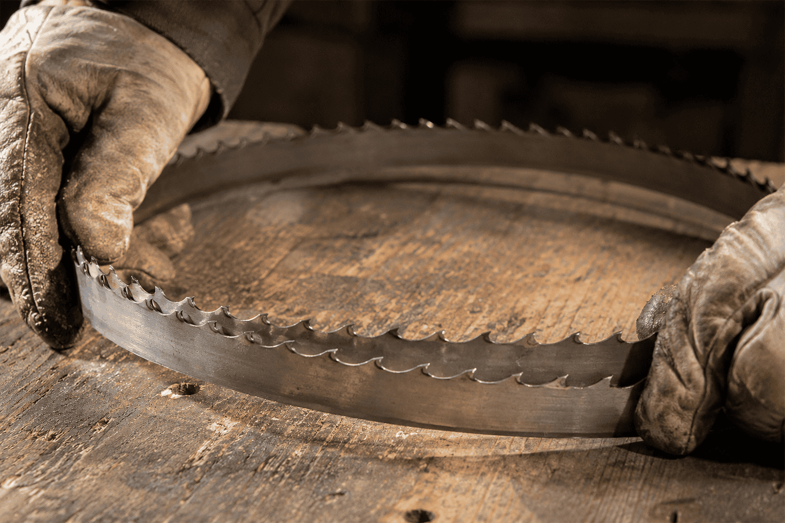 Inspecting a worn bandsaw mill blade to diagnose wavy cuts